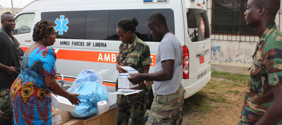 military volunteers preparing relief goods